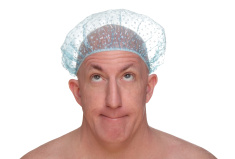 stock-photo-5575516-bald-man-in-a-shower-cap