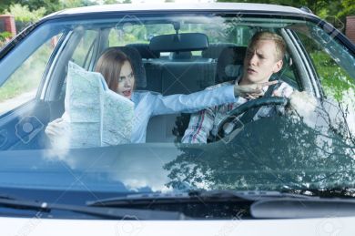 33936452-Young-couple-arguing-in-a-car-with-a-map-Stock-Photo